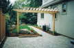 Side Yard After interlock patio walkway custom wood pergola